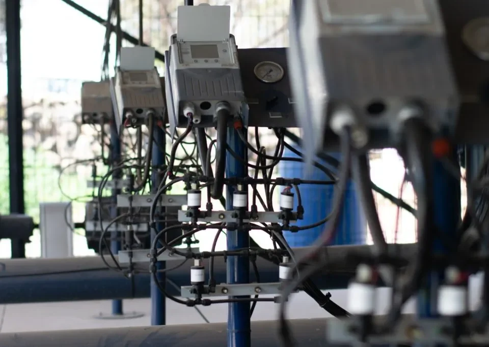 Multiple water control hardware units attached to hoses in a cultivated area, transmitting